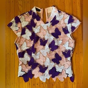 Fitted butterfly blouse. Beautiful streamline fit.